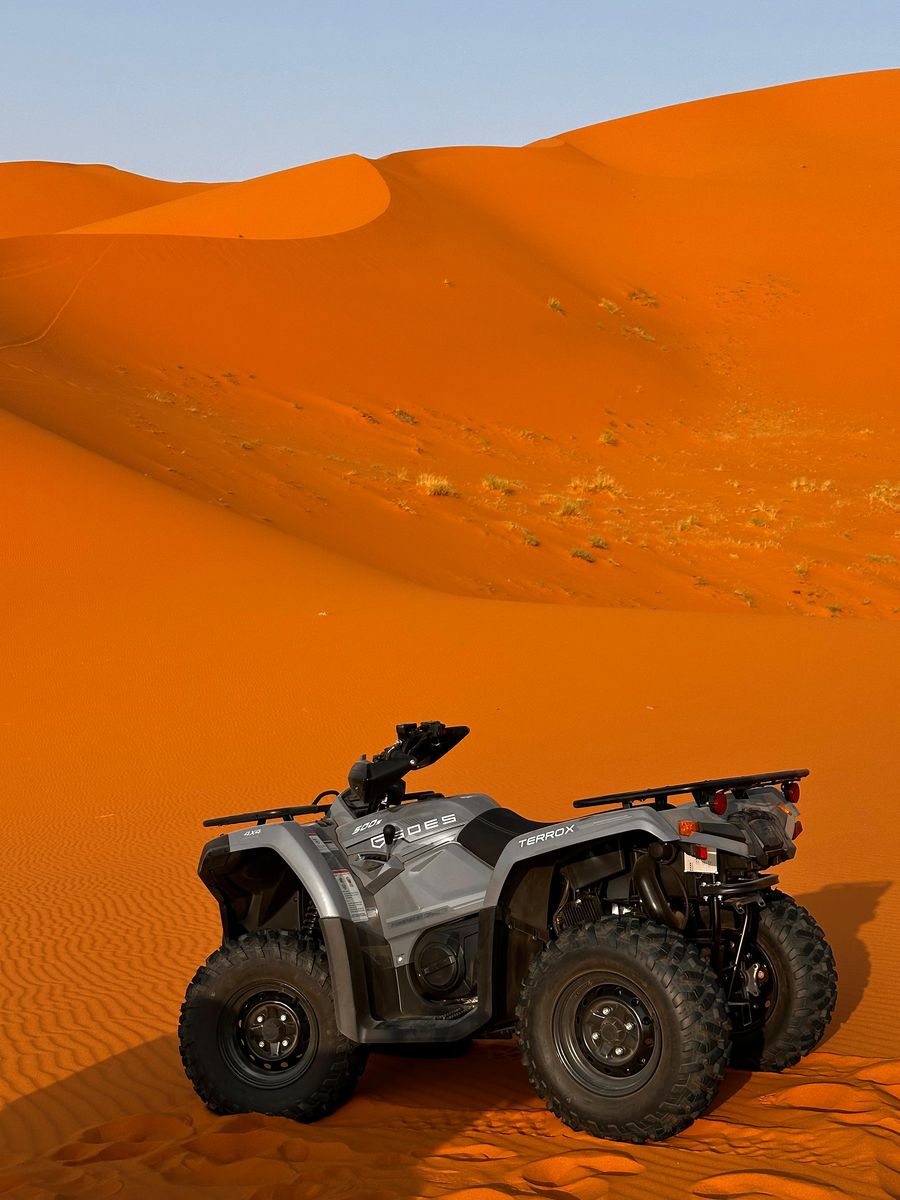 Quad bike on the desert dunes